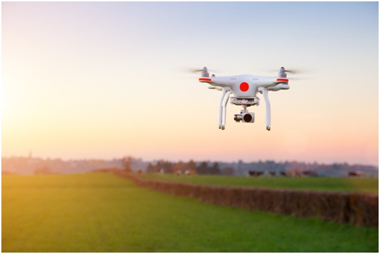 Drone camera flying across fields